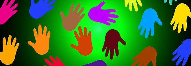 Illustration of many different colored hands on a green background